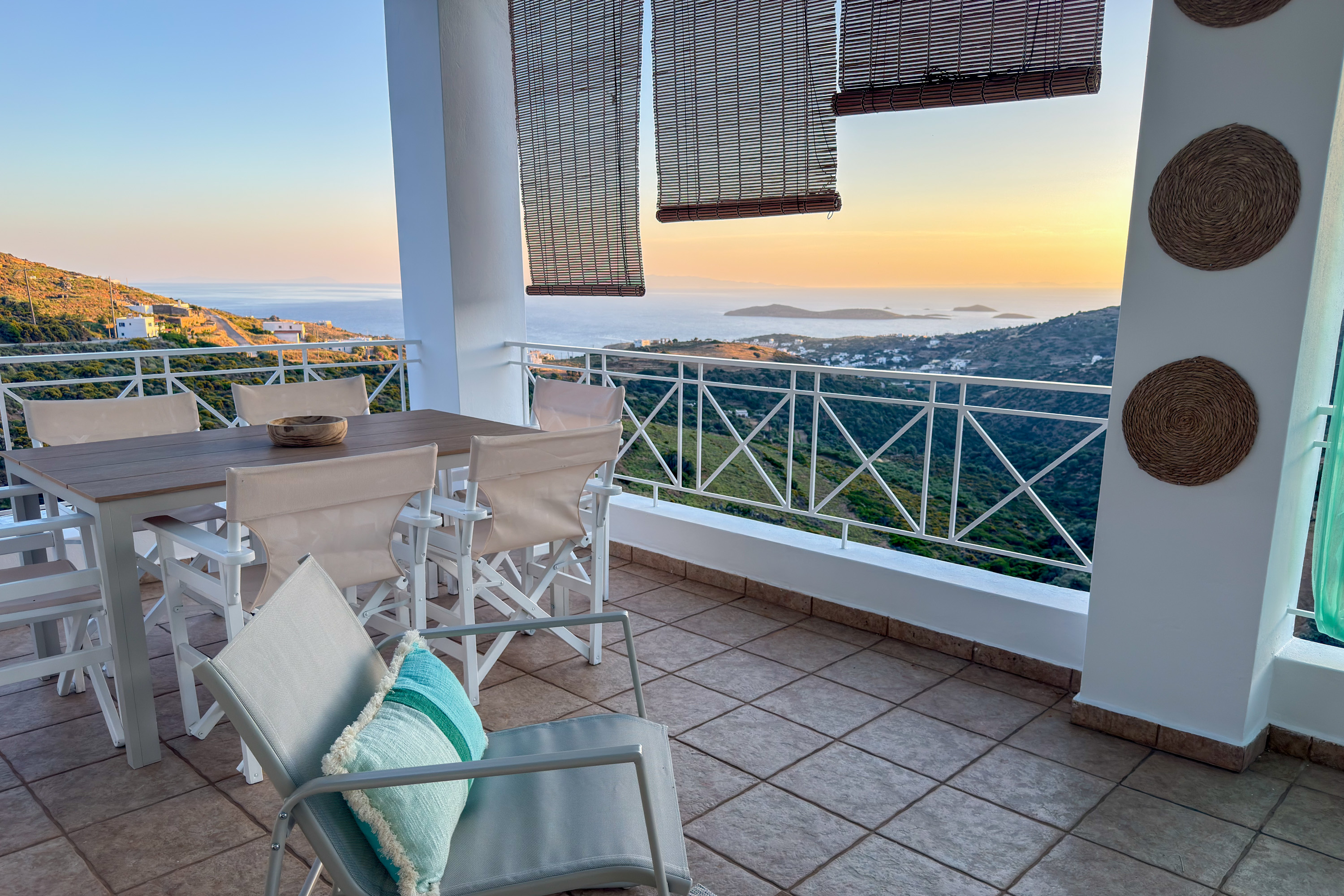 Terrace at golden hour with sweeping Aegean sea view
